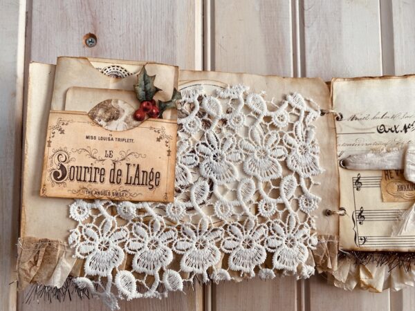Close up of lace pocket on journal page