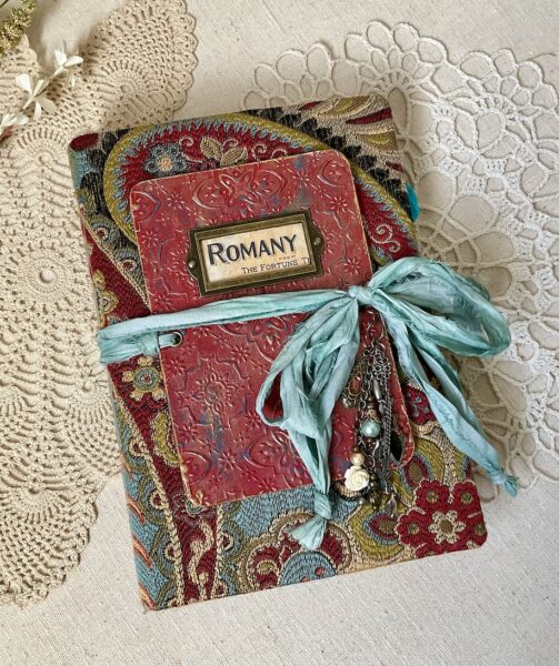 Red junk journal cover with green ribbon