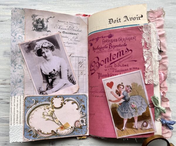 Journal spread with vintage pink document and old photos