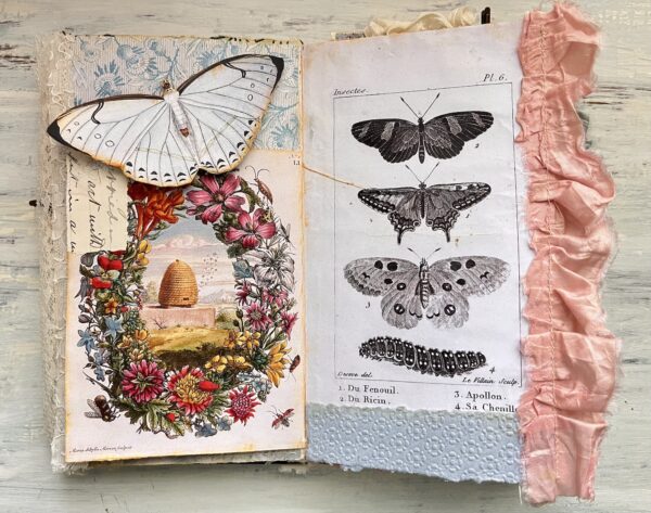 Journal spread with floral wreath and butterfly images