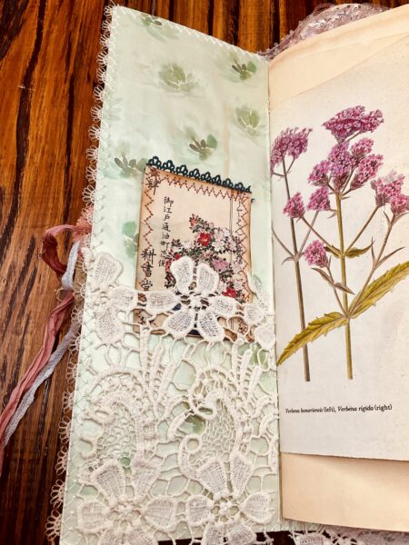 Journal spread with pink flowers and lace