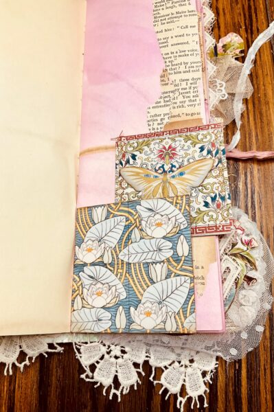Journal spread with butterfly and patterned papers