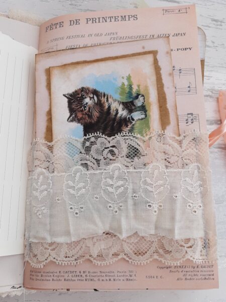 Journal page with lace band and kitten image