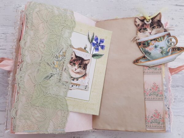 Journal page with kuitten image and lace pocket