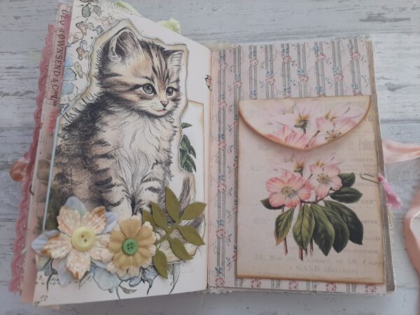Journal spread with cat image and rose pocket