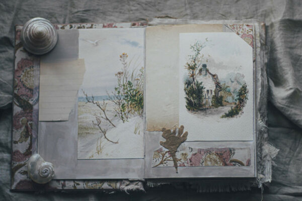 Journal spread with cottage image