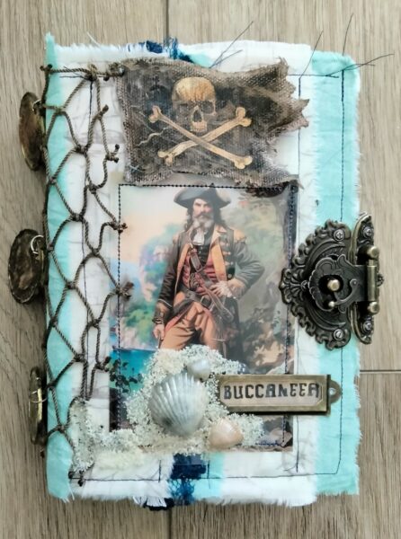 Journal cover with pirate image and fish net spine