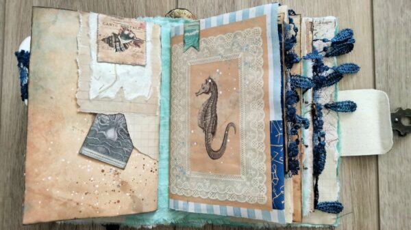 Journal spread with sea horse image and tuck spot