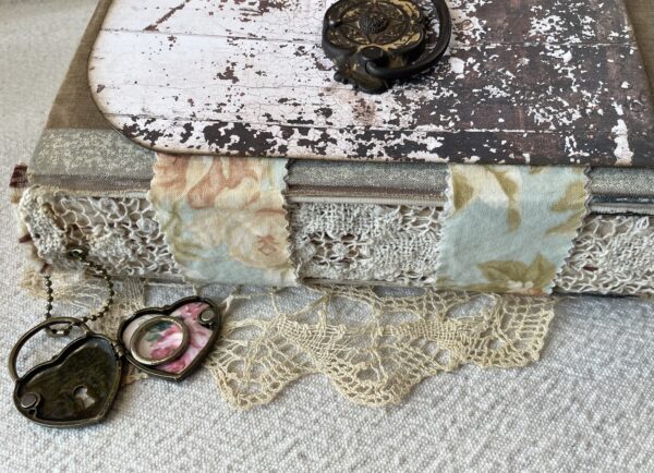 Side view of journal spine with lace and fabric