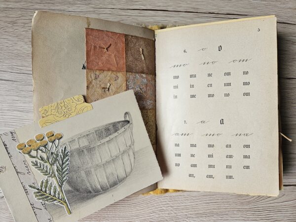 Journal spread with image of water barrel