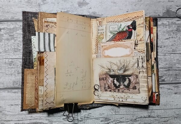 Journal spread with pockets and bird image