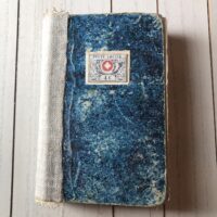 Junk journal with mottled blue cover and cream spine