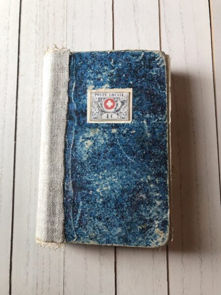 Junk journal with mottled blue cover and cream spine