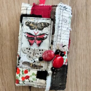 Junk journal cover with red and black butterflies