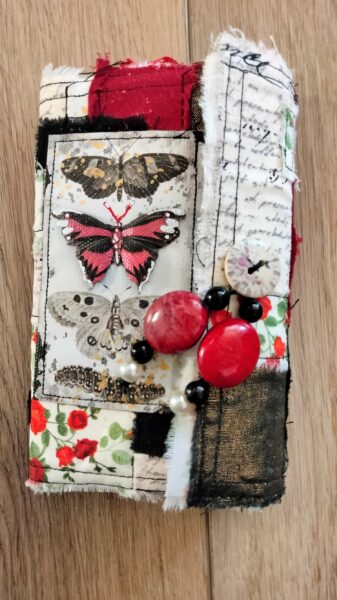 Junk journal cover with red and black butterflies