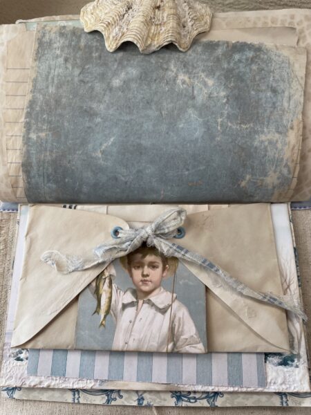 Junk journal spread with boy image and vintage envelope