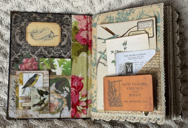 Junk journal spread with tuck spot and tags