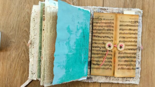 Journal page with music paper and button closure