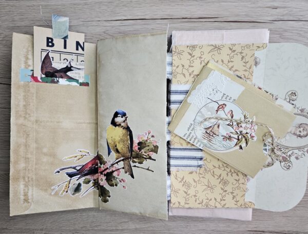 Journal spread with bird and flower branch