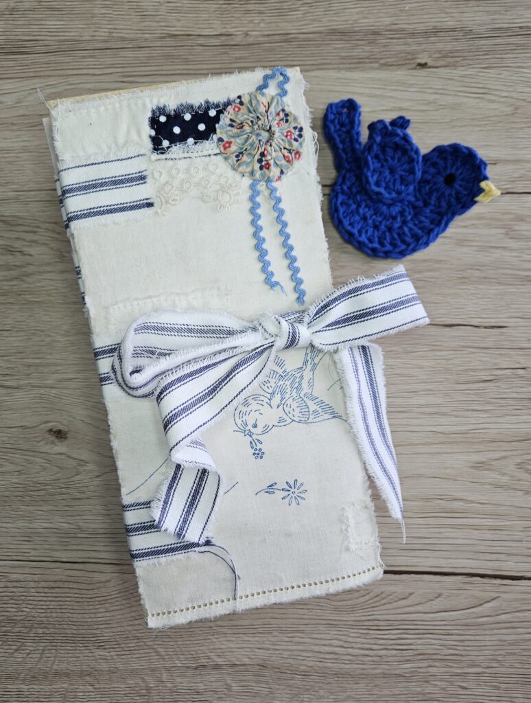 Junk journal cover with blue and white stripe ribbon