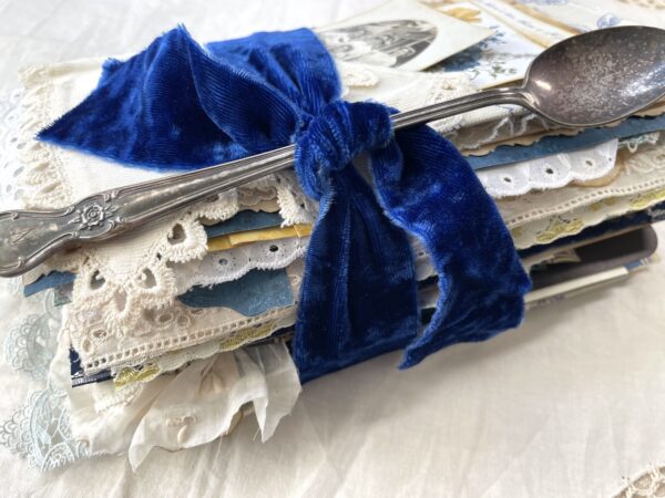 Side view of junk journal with blue velvet band