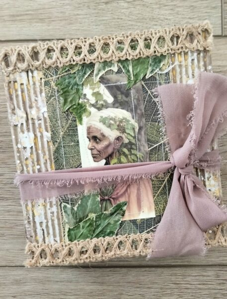 Journal cover with woman's face, leaves and pink ribbon
