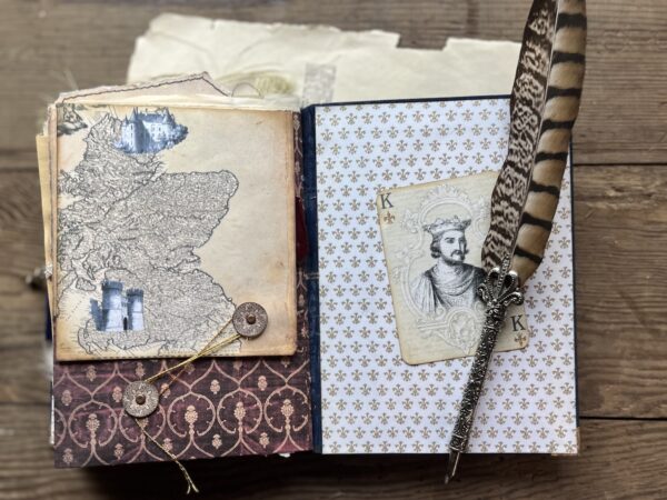 Journal spread with quill pen