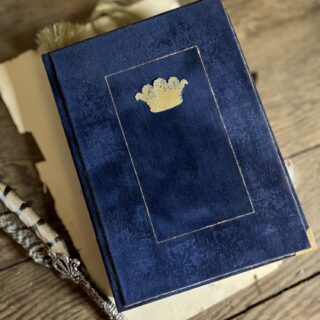 Blue journal cover with gold crown motif