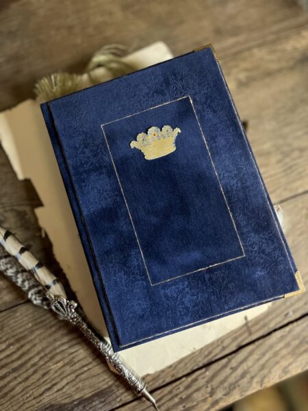 Blue journal cover with gold crown motif