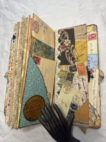 Journal spread with pockets and postage stamps