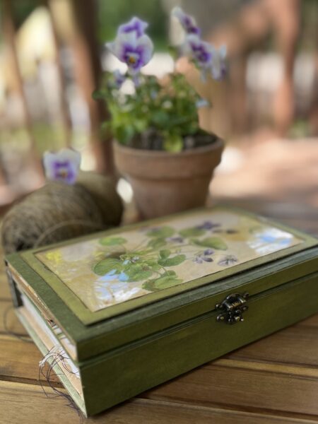 Journal cover on table with flower pots