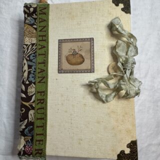 Junk journal cover with green spine and ribbon
