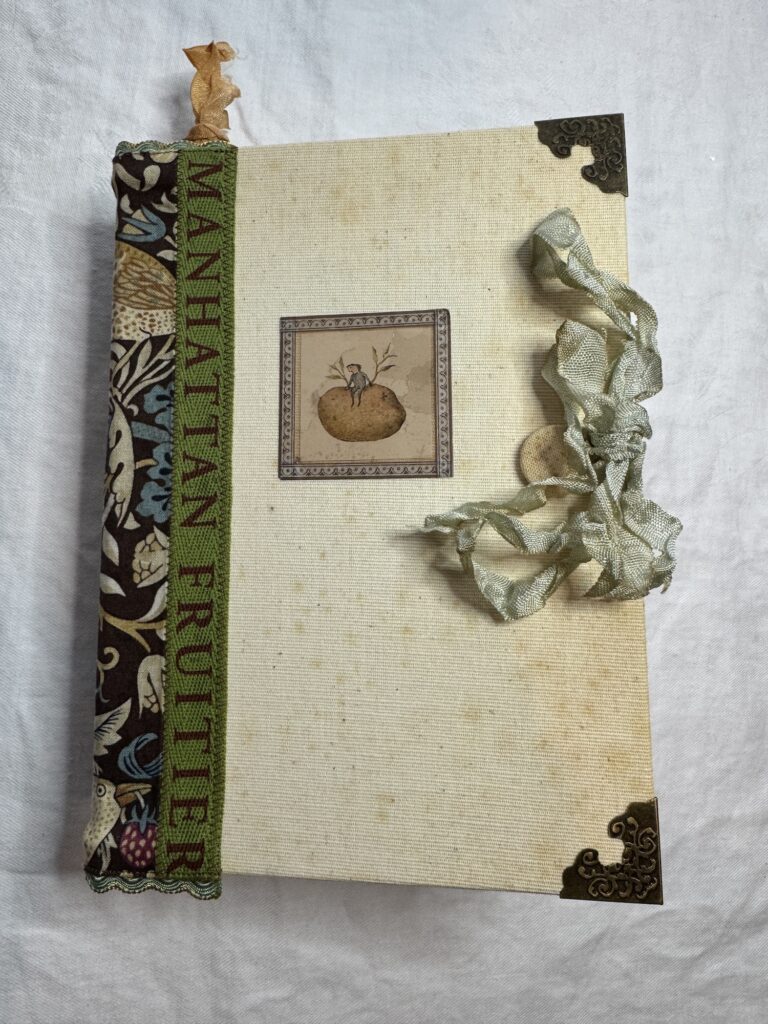 Junk journal cover with green spine and ribbon