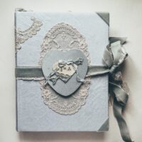 Pale blue journal cover with love heart emblem
