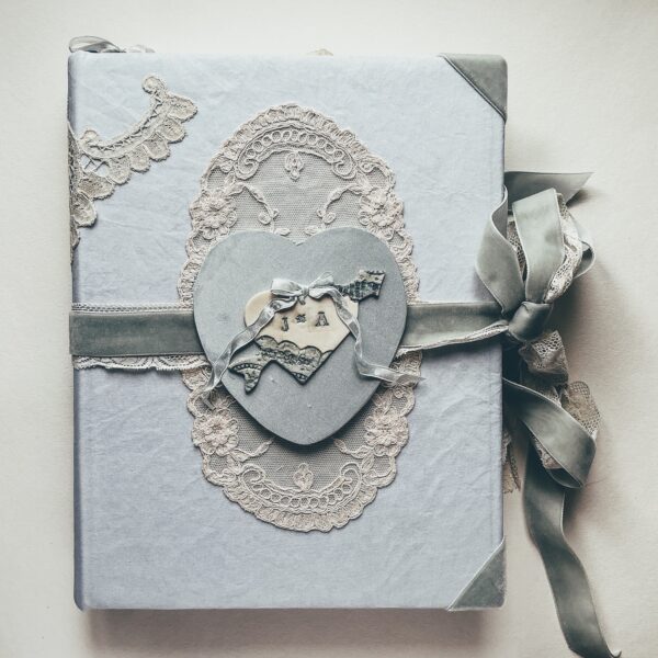 Pale blue journal cover with love heart emblem