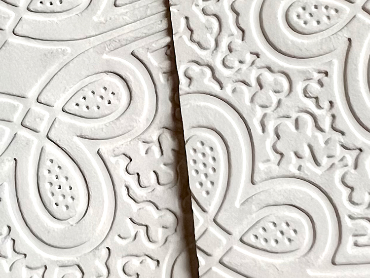 Dry cardstock embossed and wet cardstock embossed on top