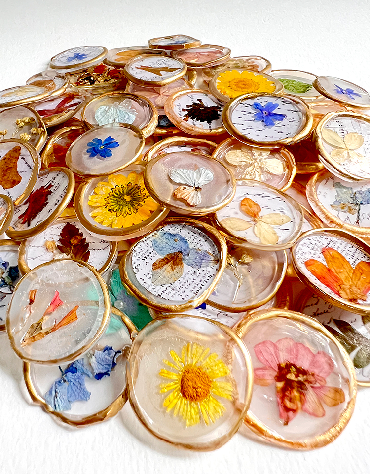 Pile of hot glue flower seals