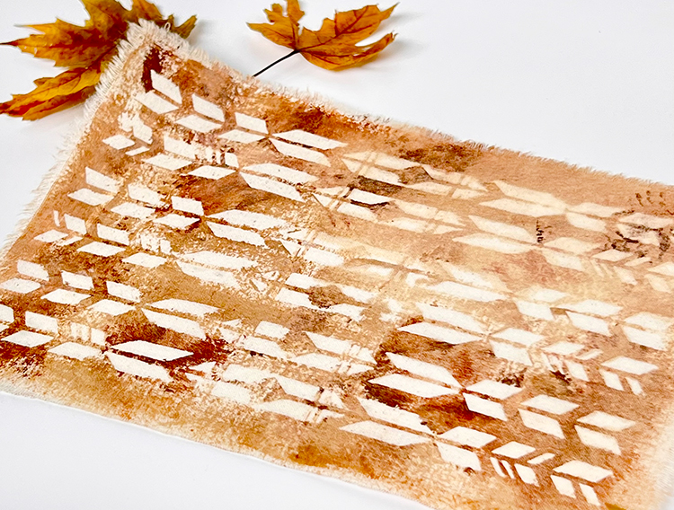 Distressed stains over batik stencil