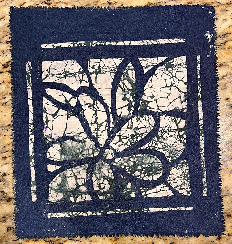 Blue fabric paint applied with stencil