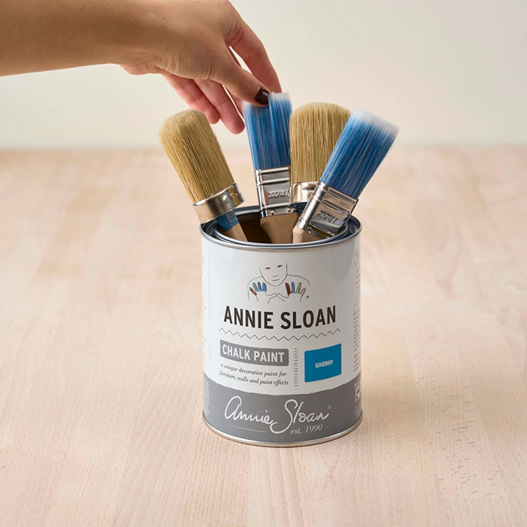 Paint tin with brushes