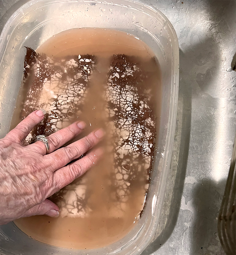Remove flour paste by rubbing fabric in basin of water for several minutes