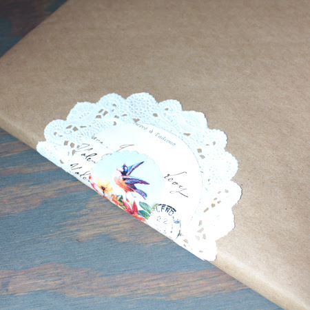 craft paper book cover with doily and birds