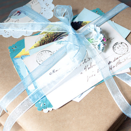 book bundles with ribbon and postcards