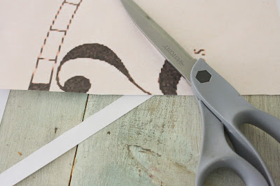 cutting out numbers with scissors