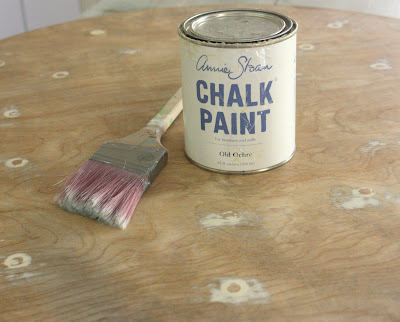 wood table top with chalk paint and brush