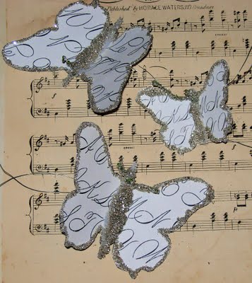 Finished butterflies on sheet music