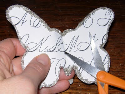 Perforating paper butterfly with scissors