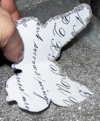 Gluing glitter on edges of butterflies