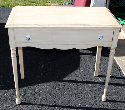Small piece of furniture with drawer before